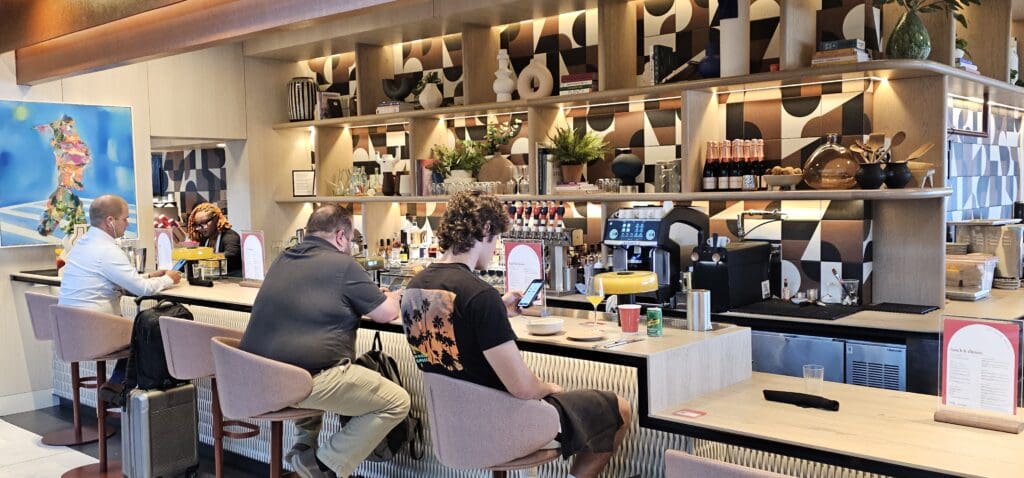 two men sitting at a bar