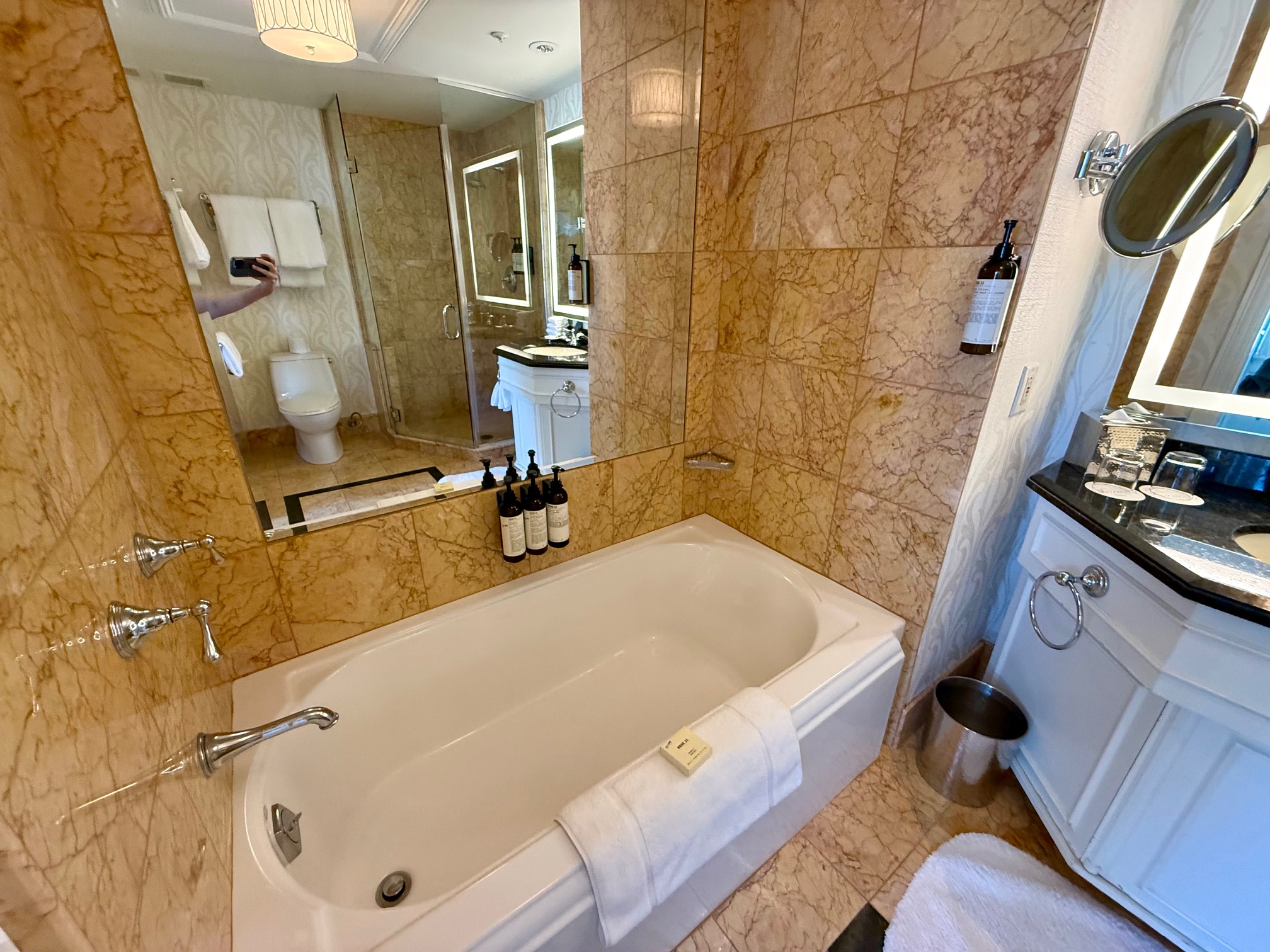 a bathroom with a bathtub and a mirror