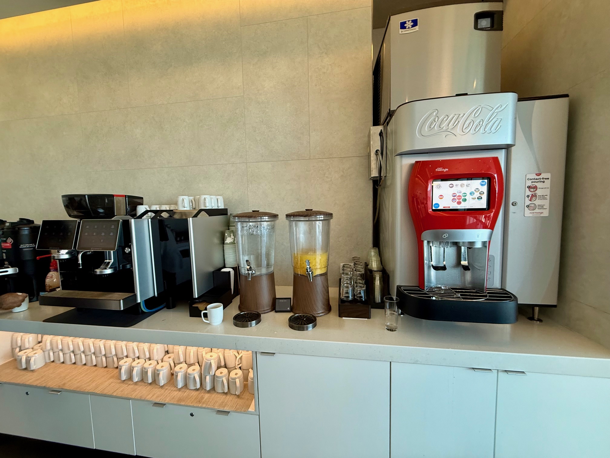 a coffee machine and coffee maker on a counter