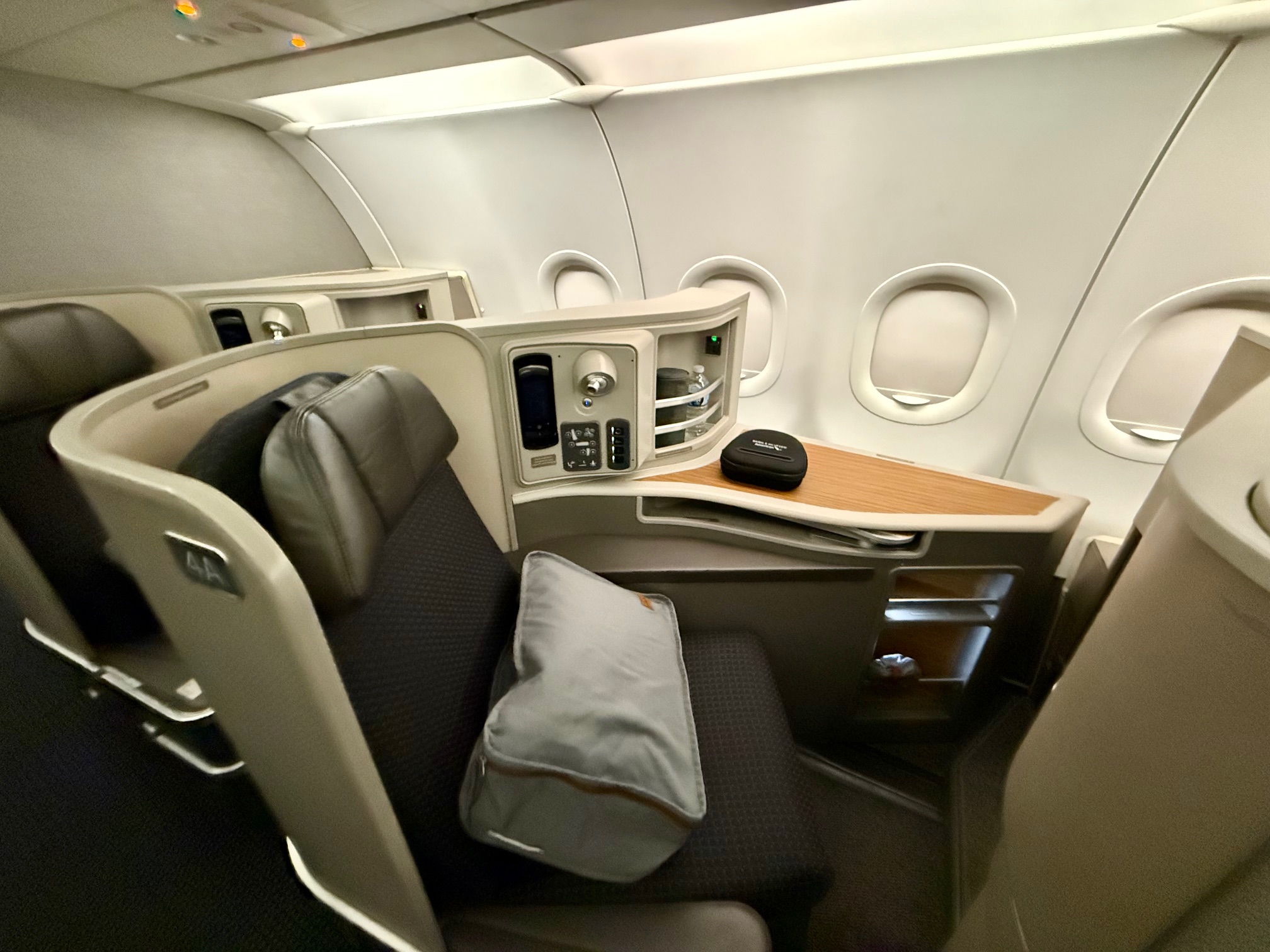 a seat in a plane on American Airlines Flagship First San Francisco to New York