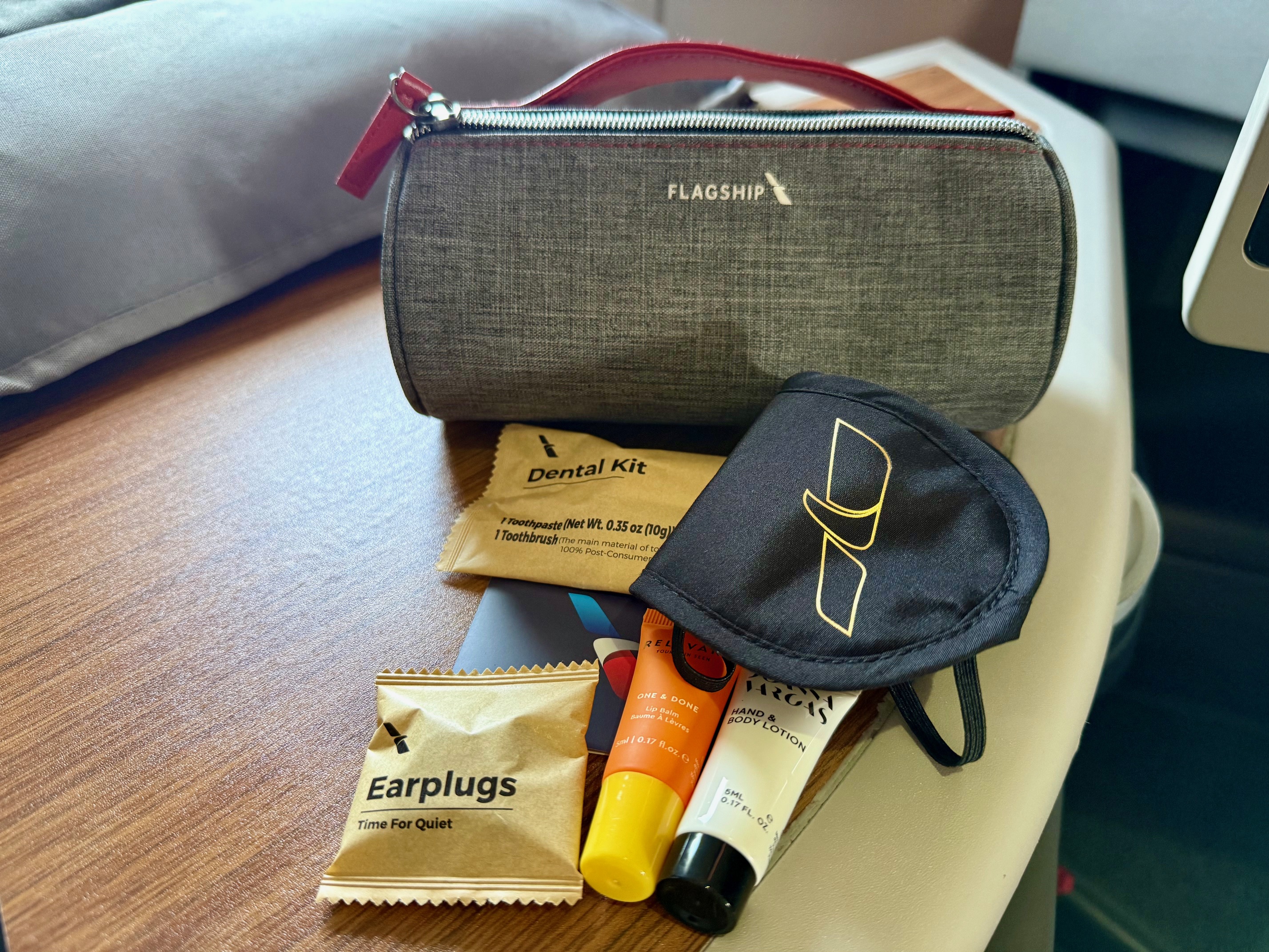 a small bag with a mask and other items on a table