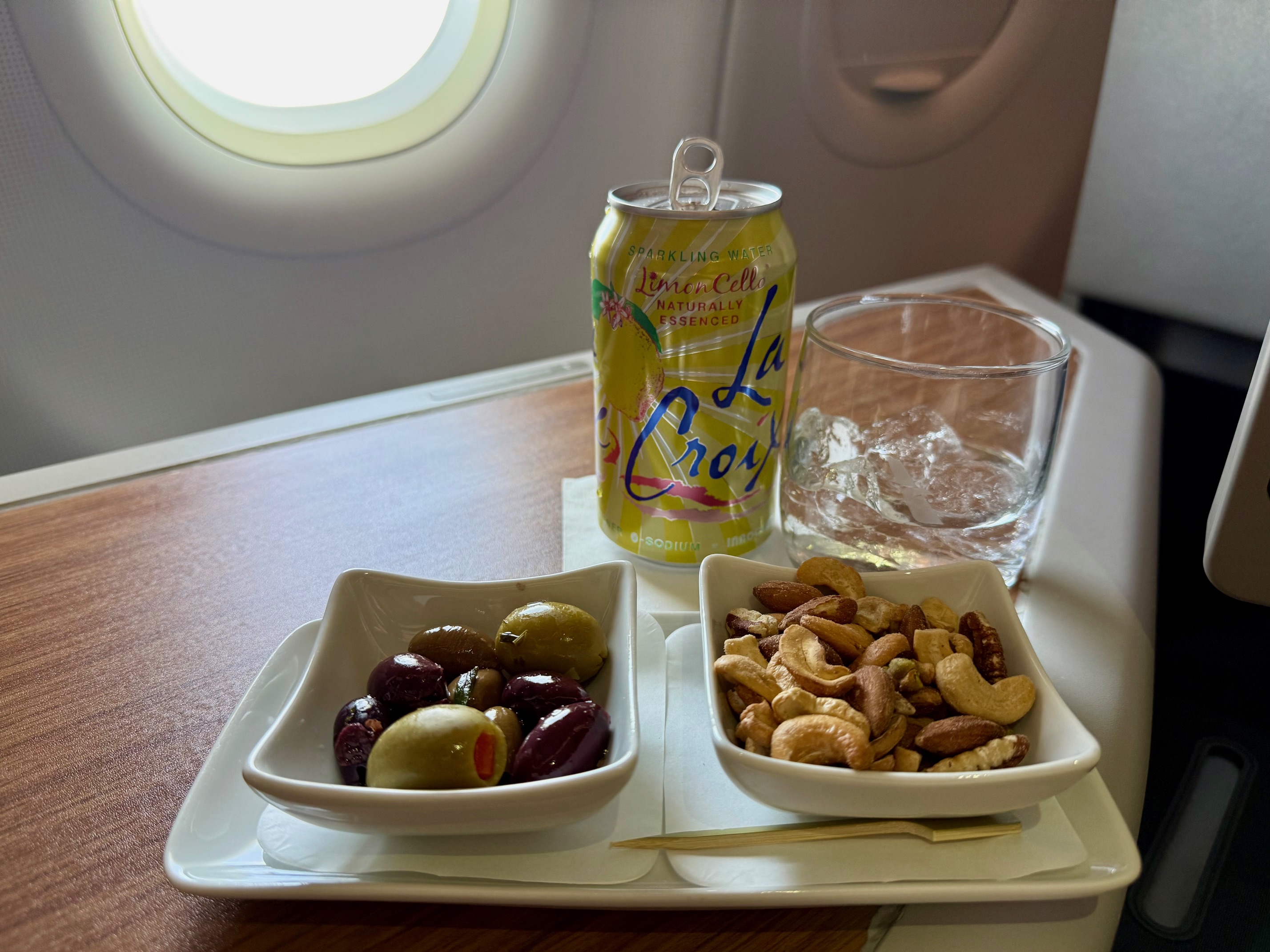 a tray of food and a can of soda on a table