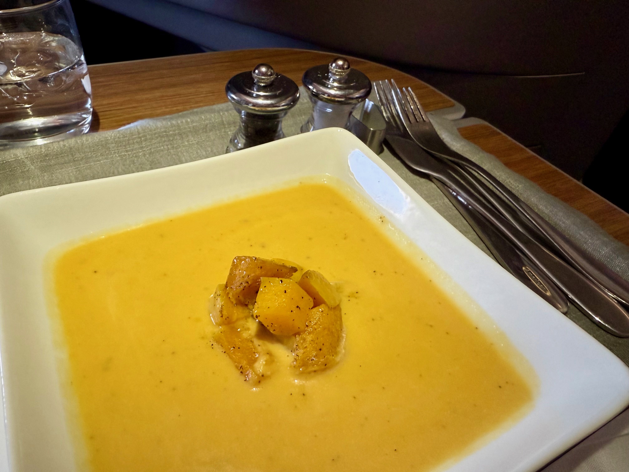 a bowl of soup with food on it