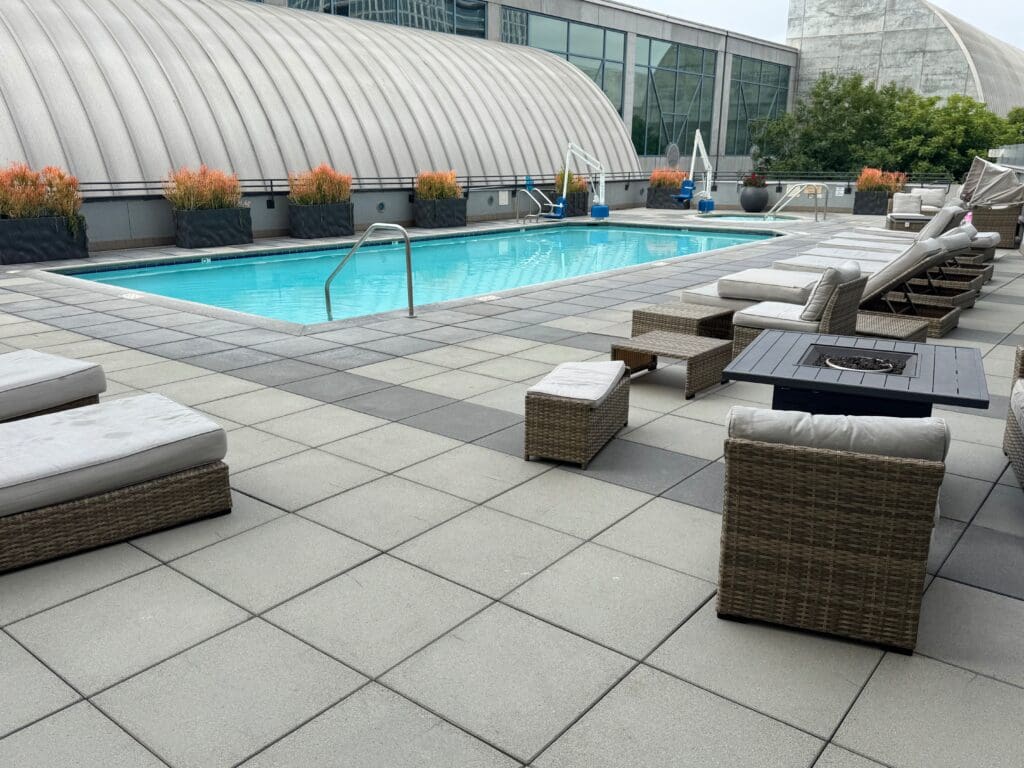 a pool with chairs and a table
