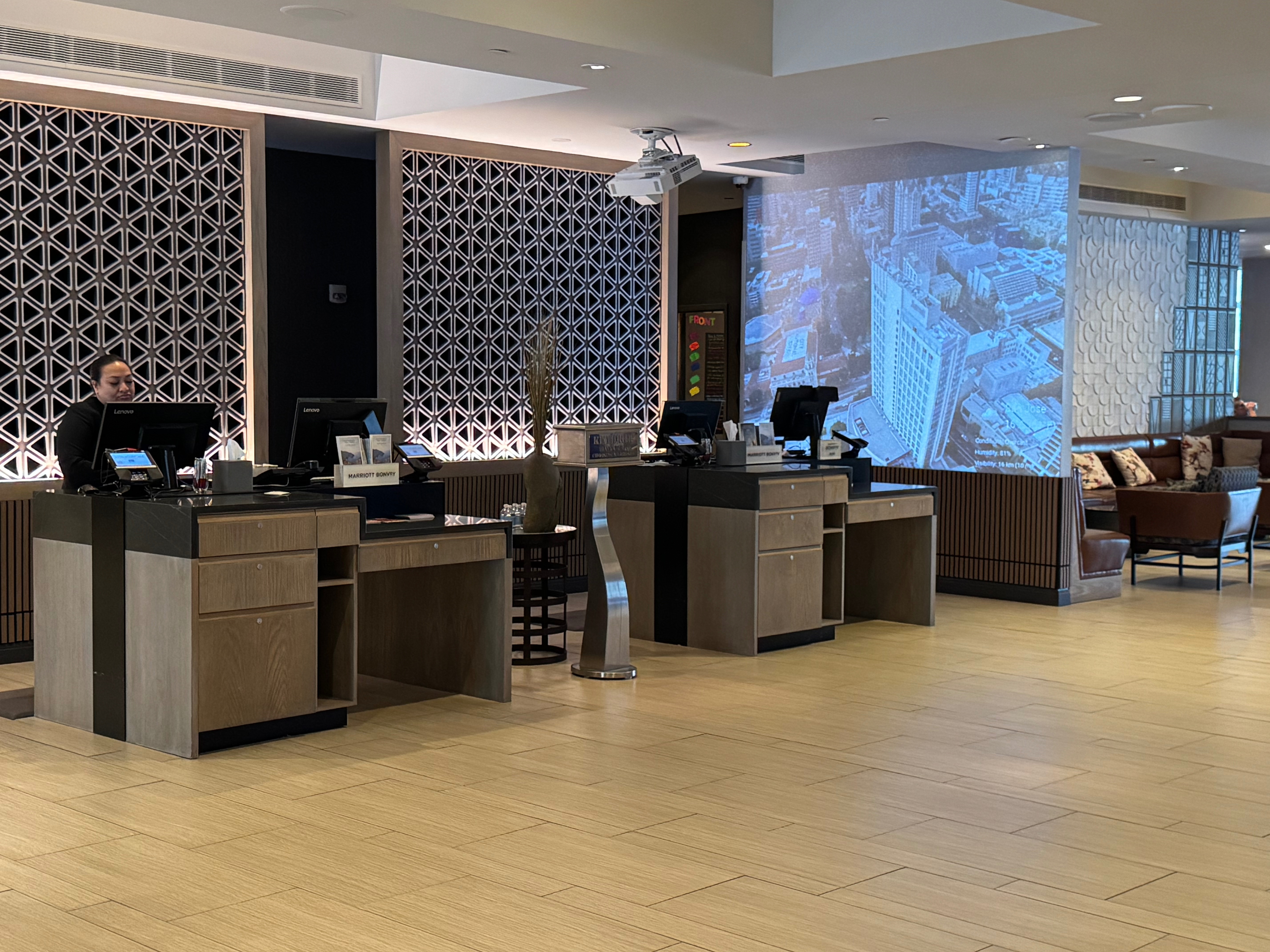 a room with a large screen and a large screen