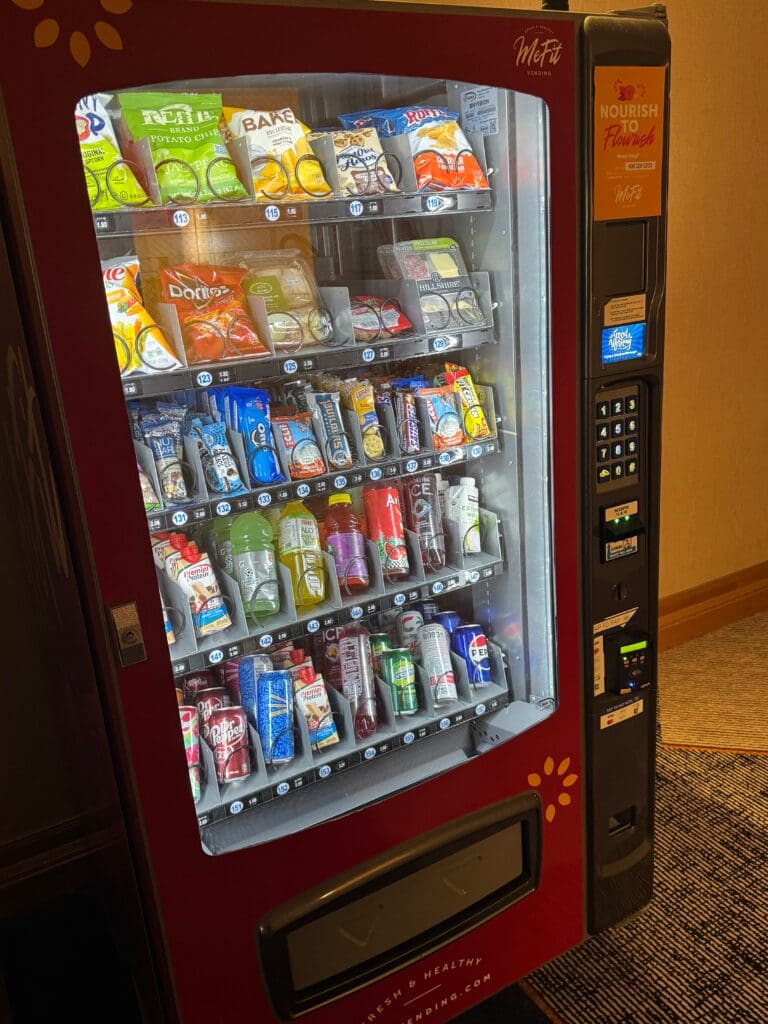 a vending machine with snacks and drinks