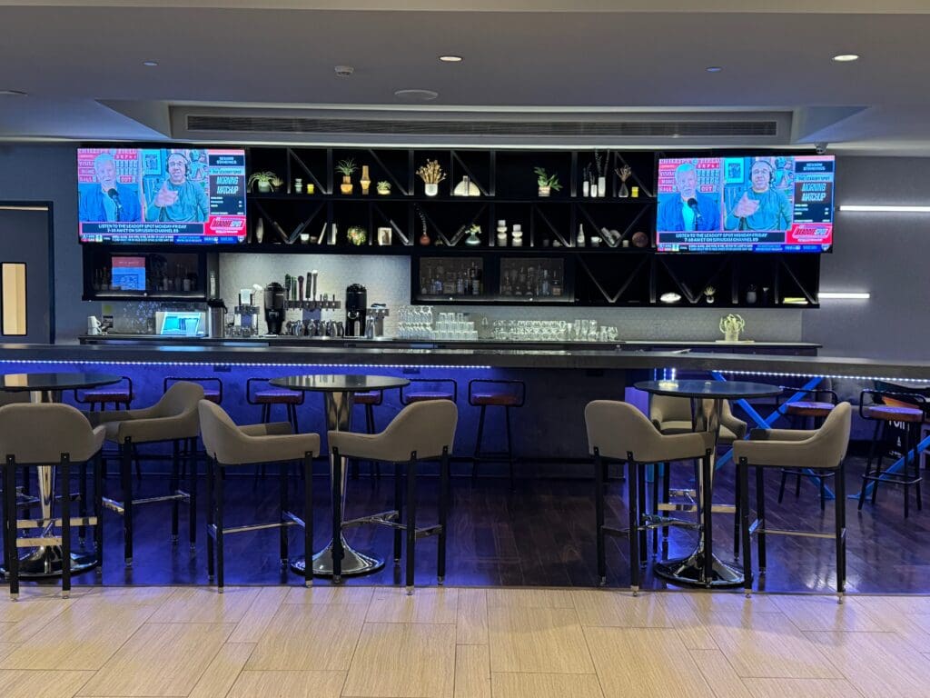 a bar with a bar and tvs