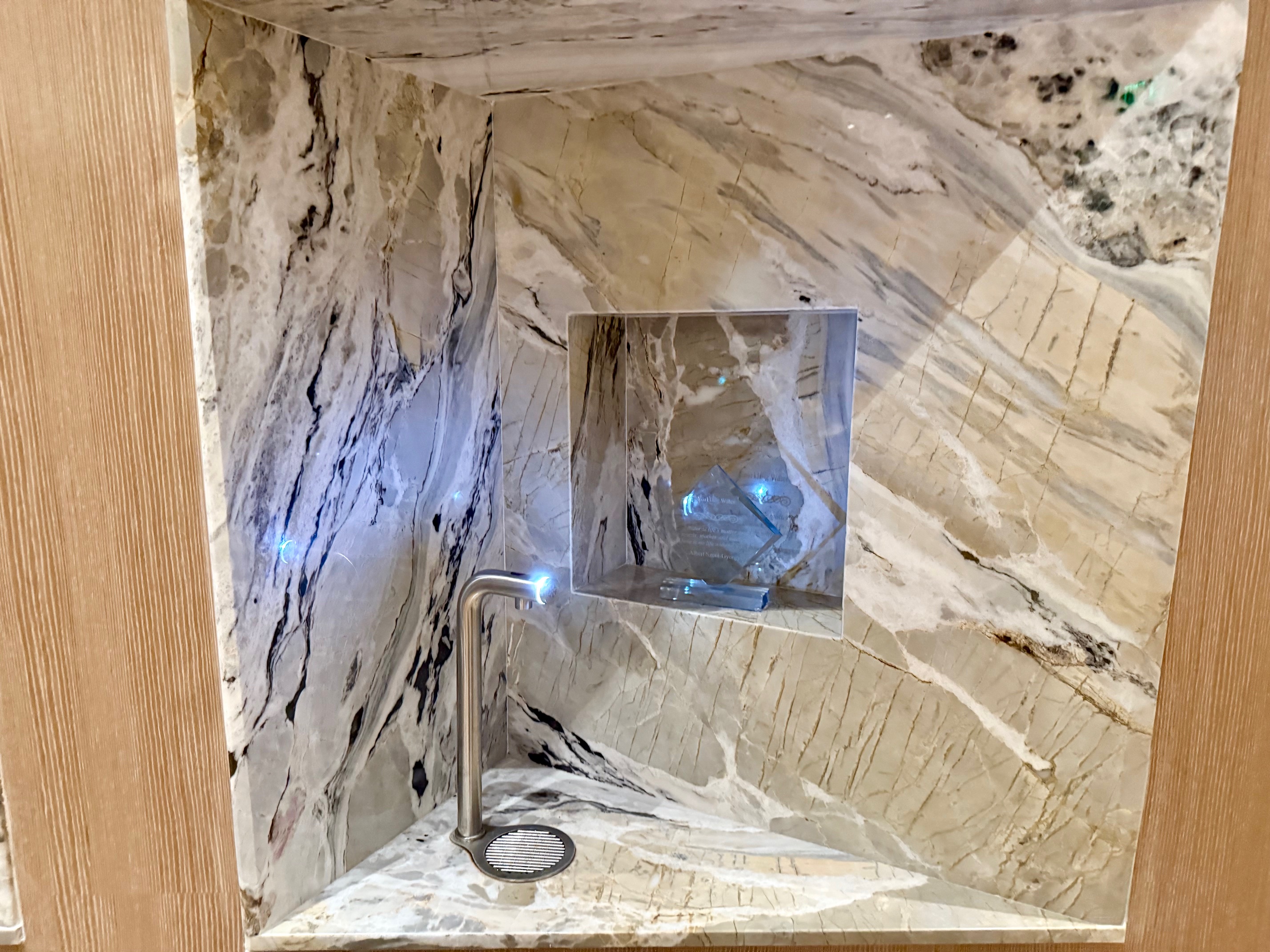 a shower in a marble wall