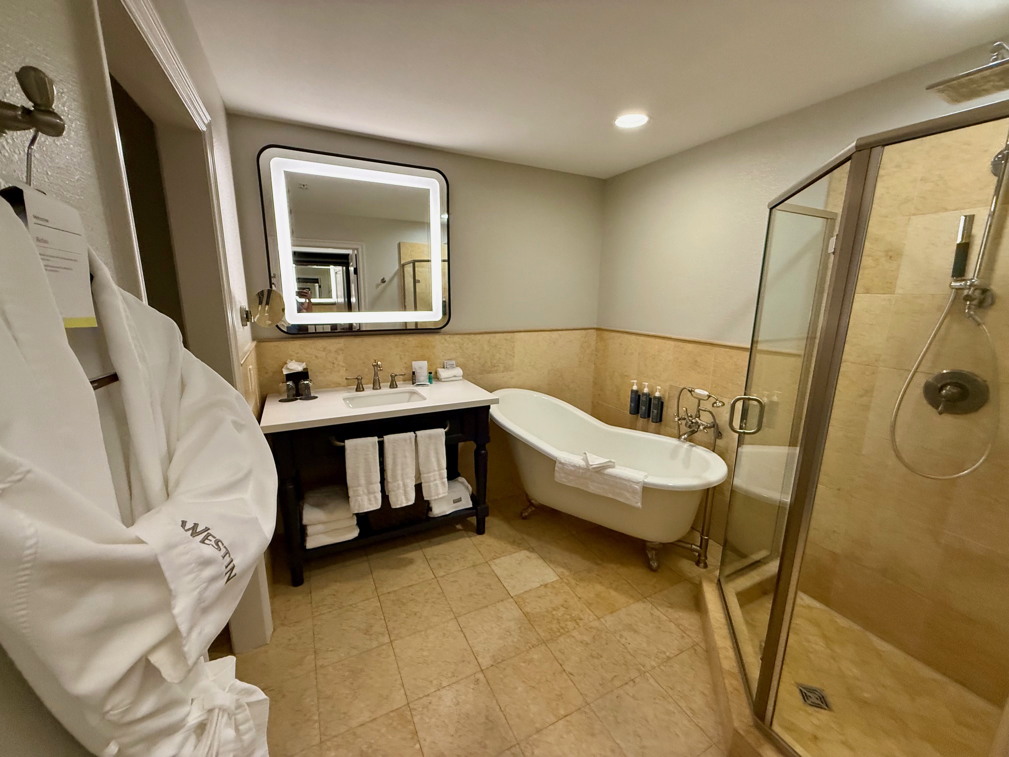 a bathroom with a bathtub and a shower at the Westin Sacramento Riverfront