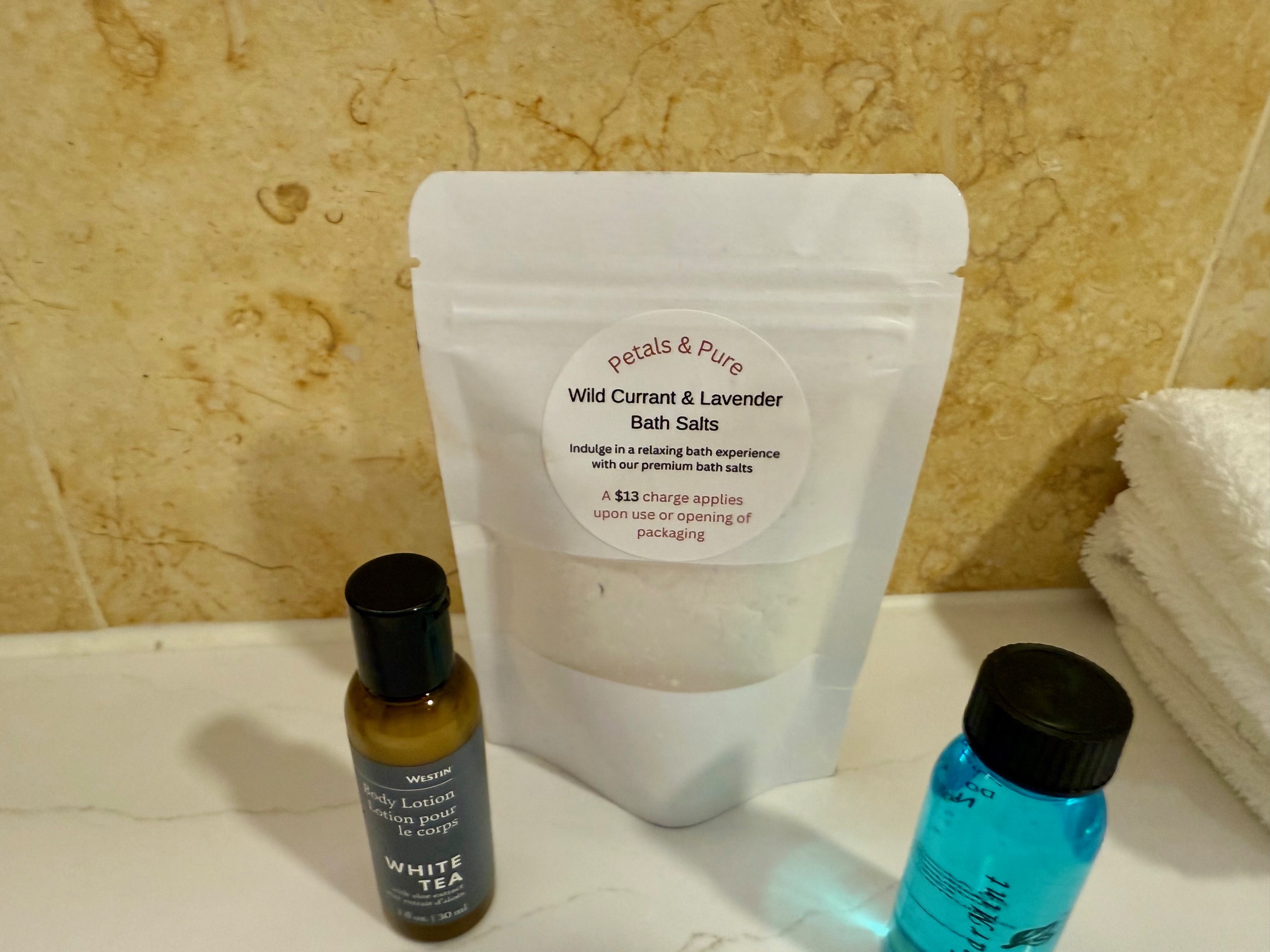 a bag of bath salts and small bottles of shampoo