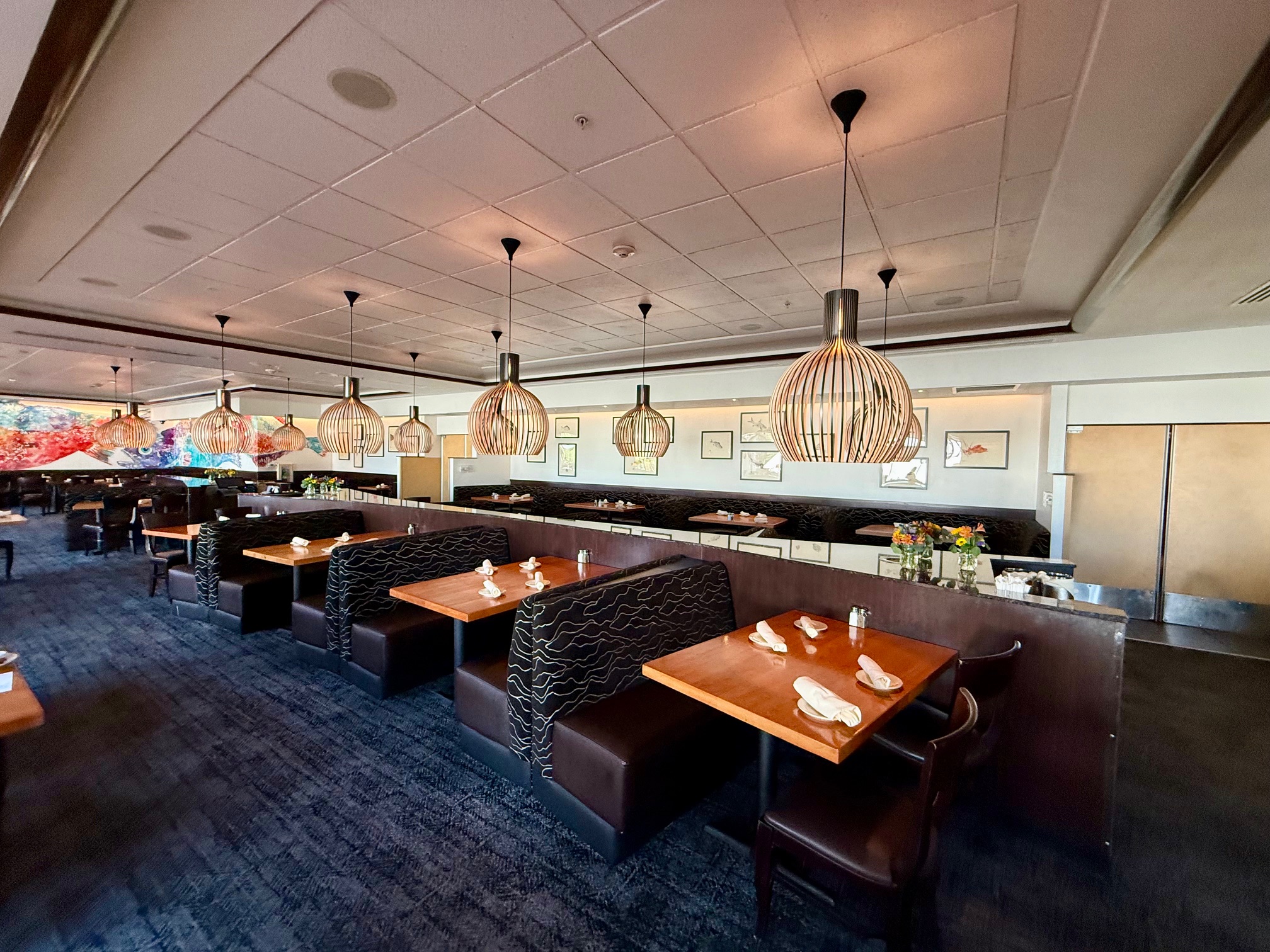 a restaurant with tables and chairs