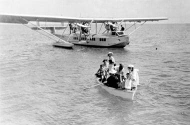 a group of people in a boat on the water