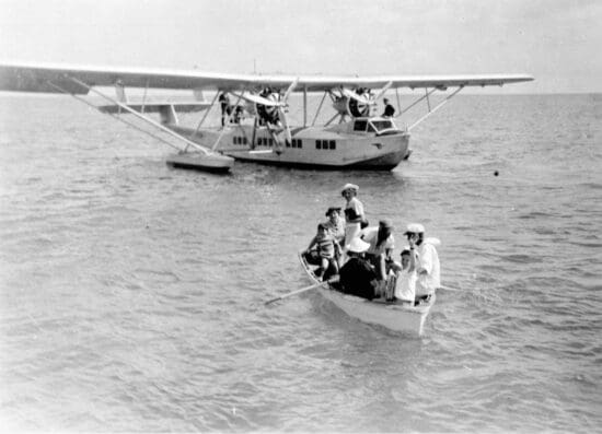 a group of people in a boat on the water