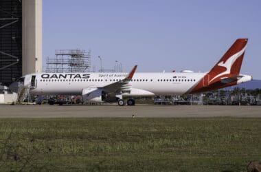 a large white airplane on a runway