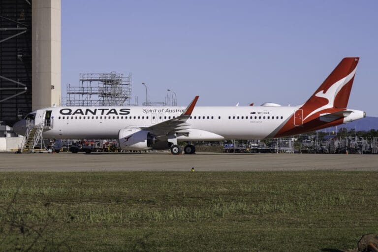 a large white airplane on a runway
