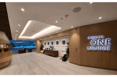 a lobby with a sign and a chair