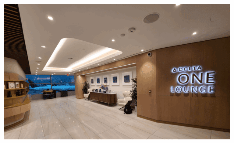 a lobby with a sign and a chair
