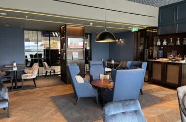 a room with blue chairs and a table