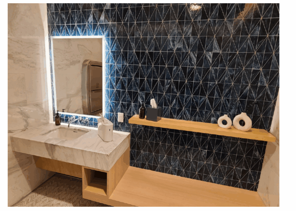 a bathroom with a mirror and sink