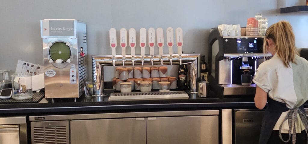 a group of taps of a drink dispenser