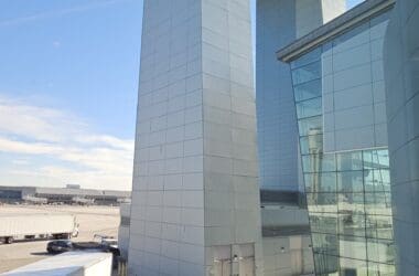 a large white building with a circular structure