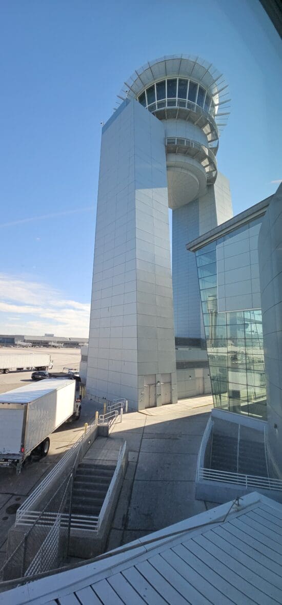 a large white building with a circular structure