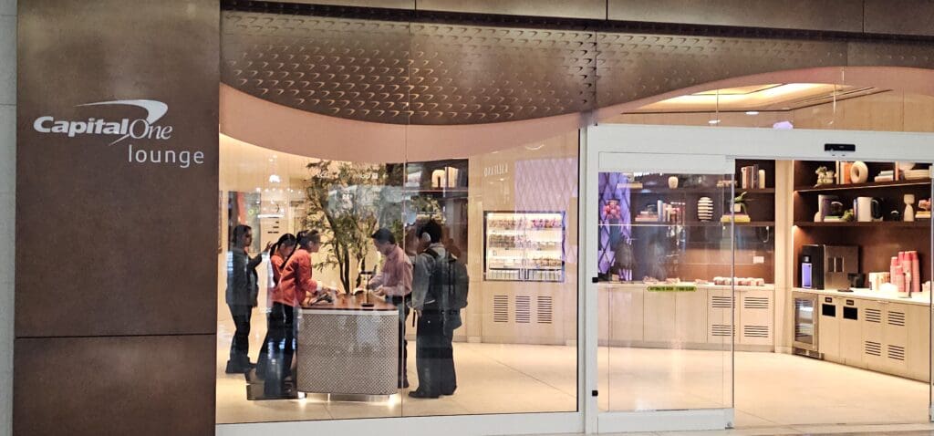 a group of people standing around a table in front of a store