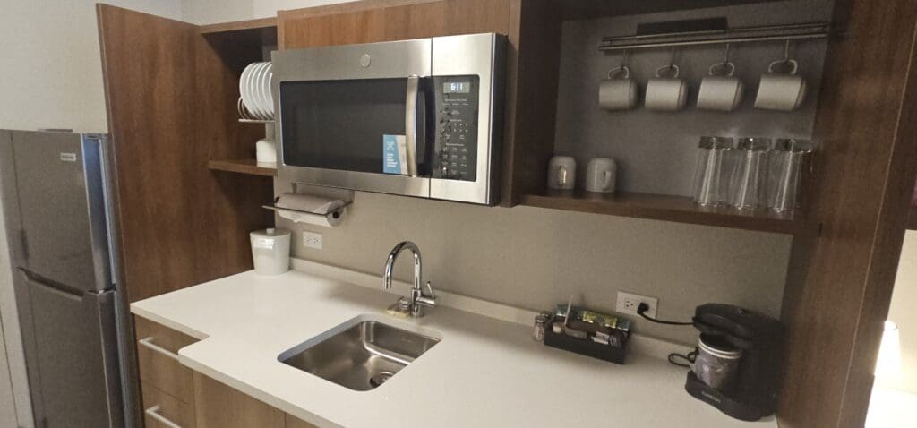 a microwave above a sink