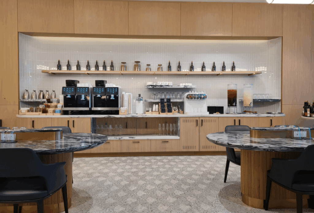 a coffee shop with a counter and tables