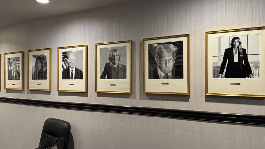 a group of framed pictures on a wall