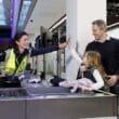 a man and woman giving a high five to a child