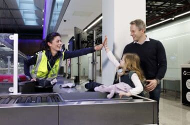 a man and woman giving a high five to a child