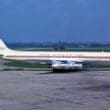 a white airplane on a runway
