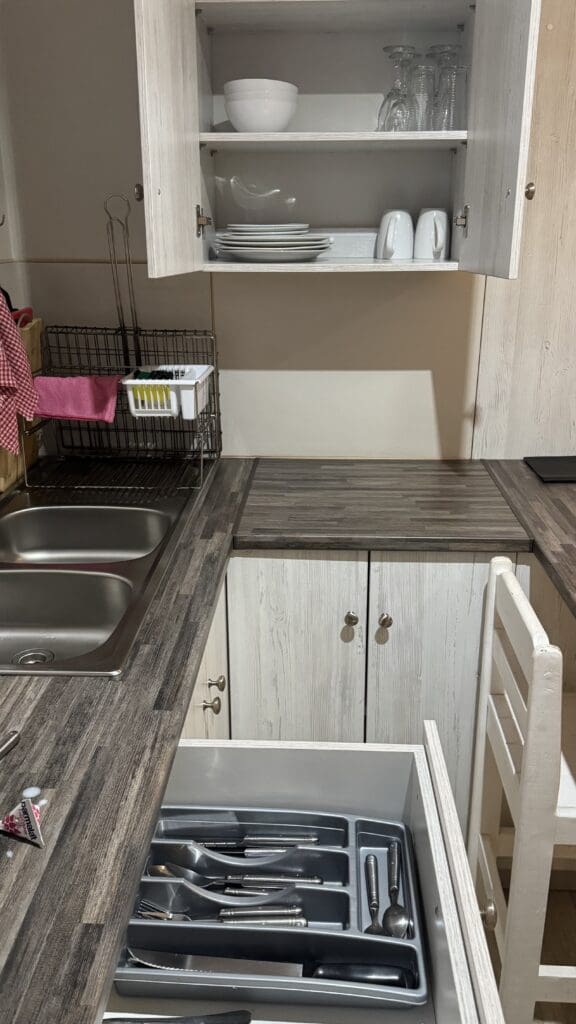 a kitchen with a sink and cupboards