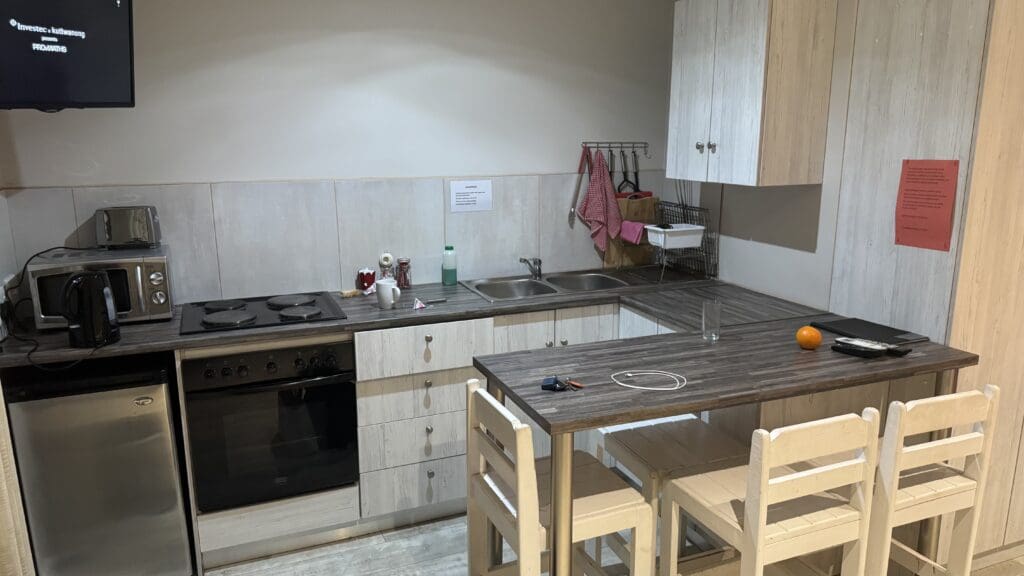 a kitchen with a table and chairs