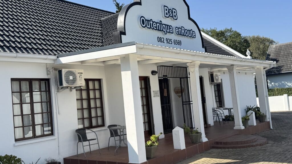 a white building with a sign on it