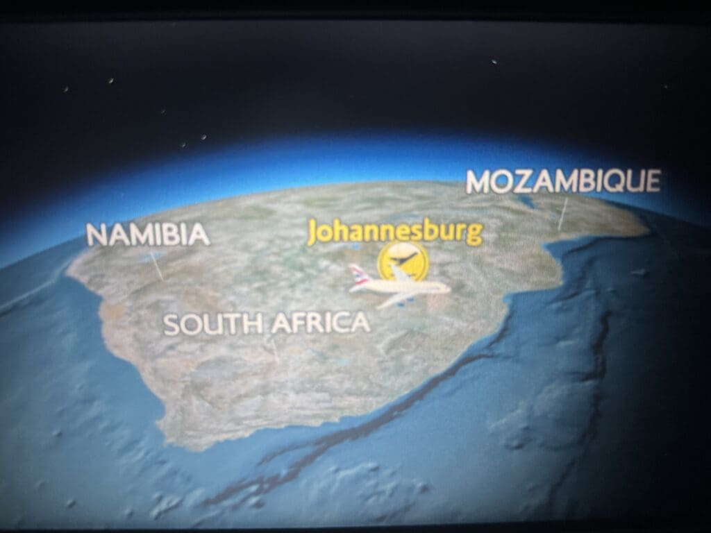 a map of the earth with an airplane flying above it