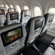 a row of seats in a JetBlue Airbus A220 aircraft