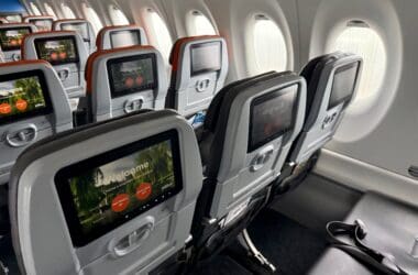 a row of seats in a JetBlue Airbus A220 aircraft