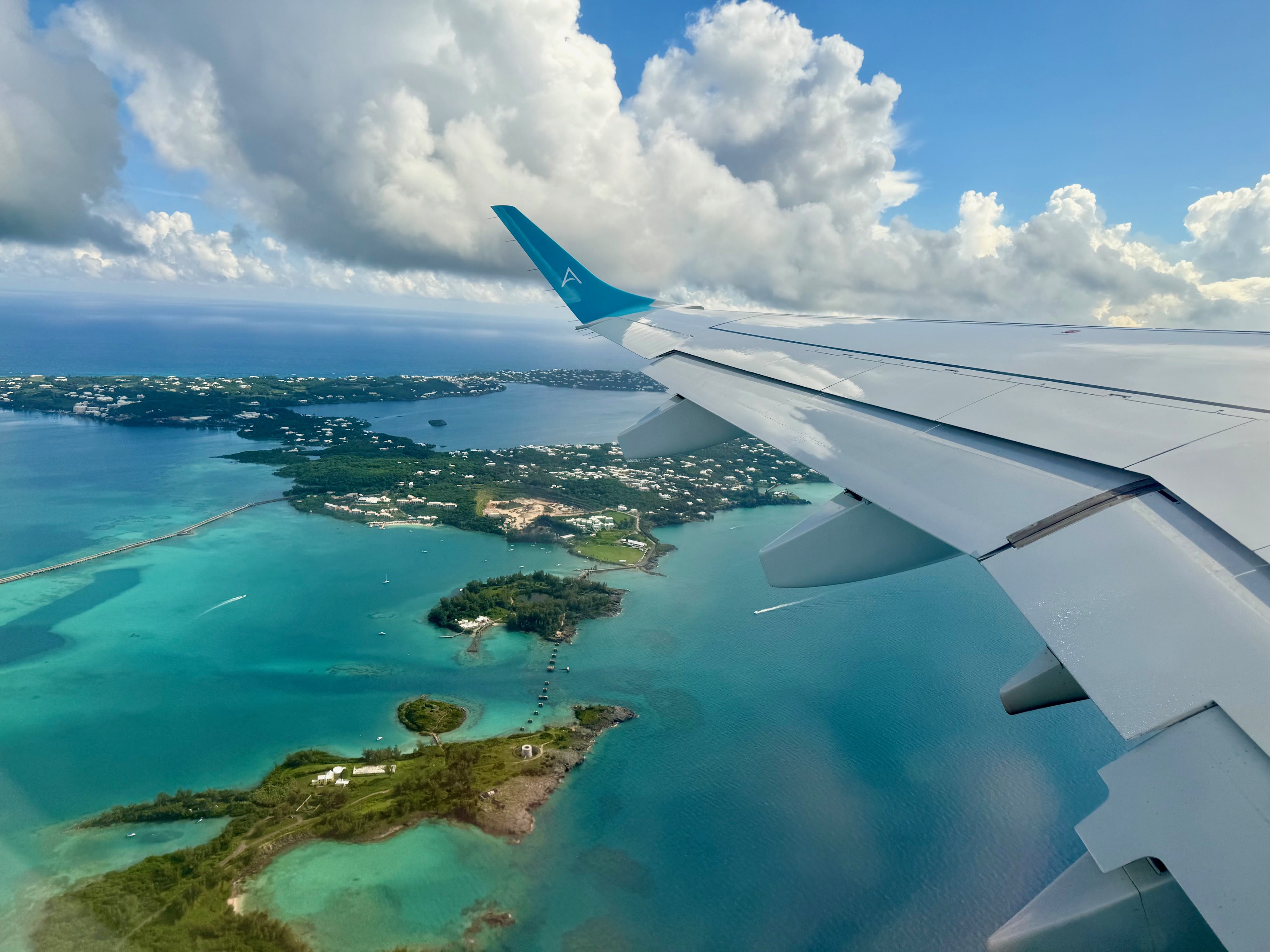 an airplane wing over an island