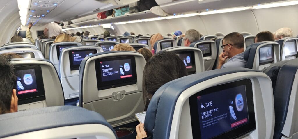 a group of people sitting in an airplane