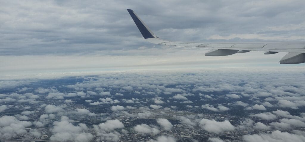 an airplane wing in the sky