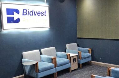 a group of blue chairs in a room