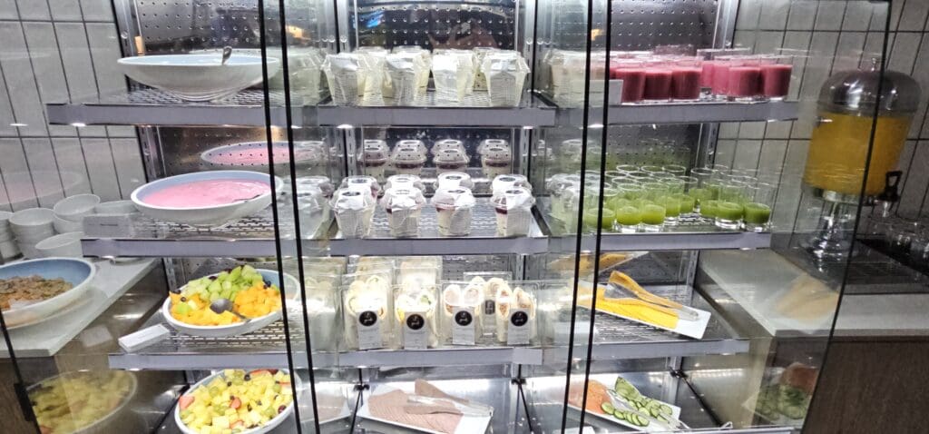 a display case with food on shelves