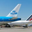 a group of airplanes on a runway