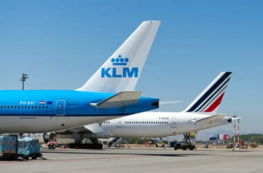 a group of airplanes on a runway