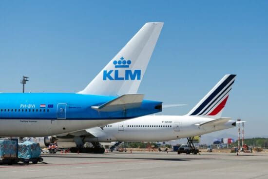 a group of airplanes on a runway