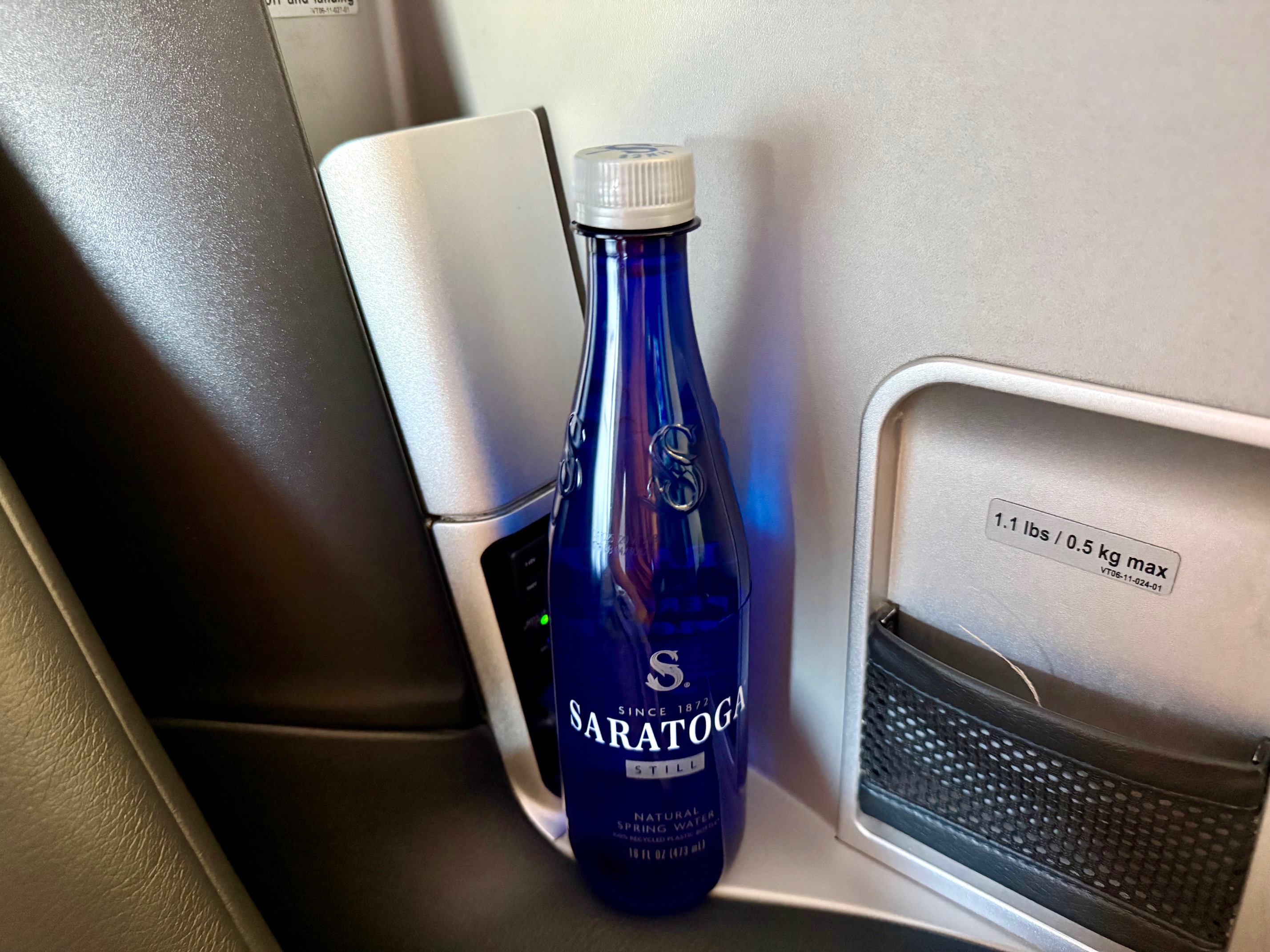 a blue bottle on a table