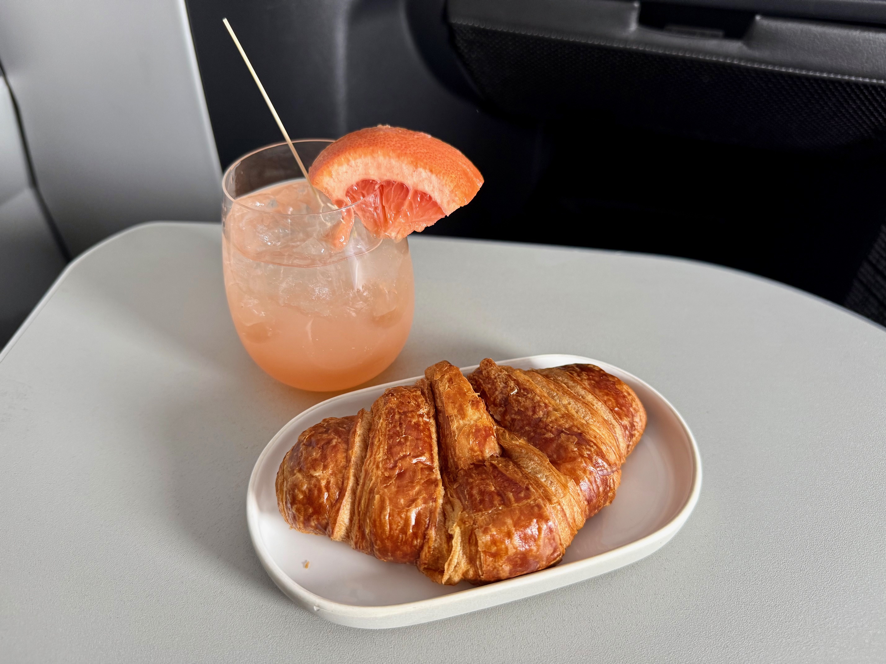 a plate of food and a drink on a table