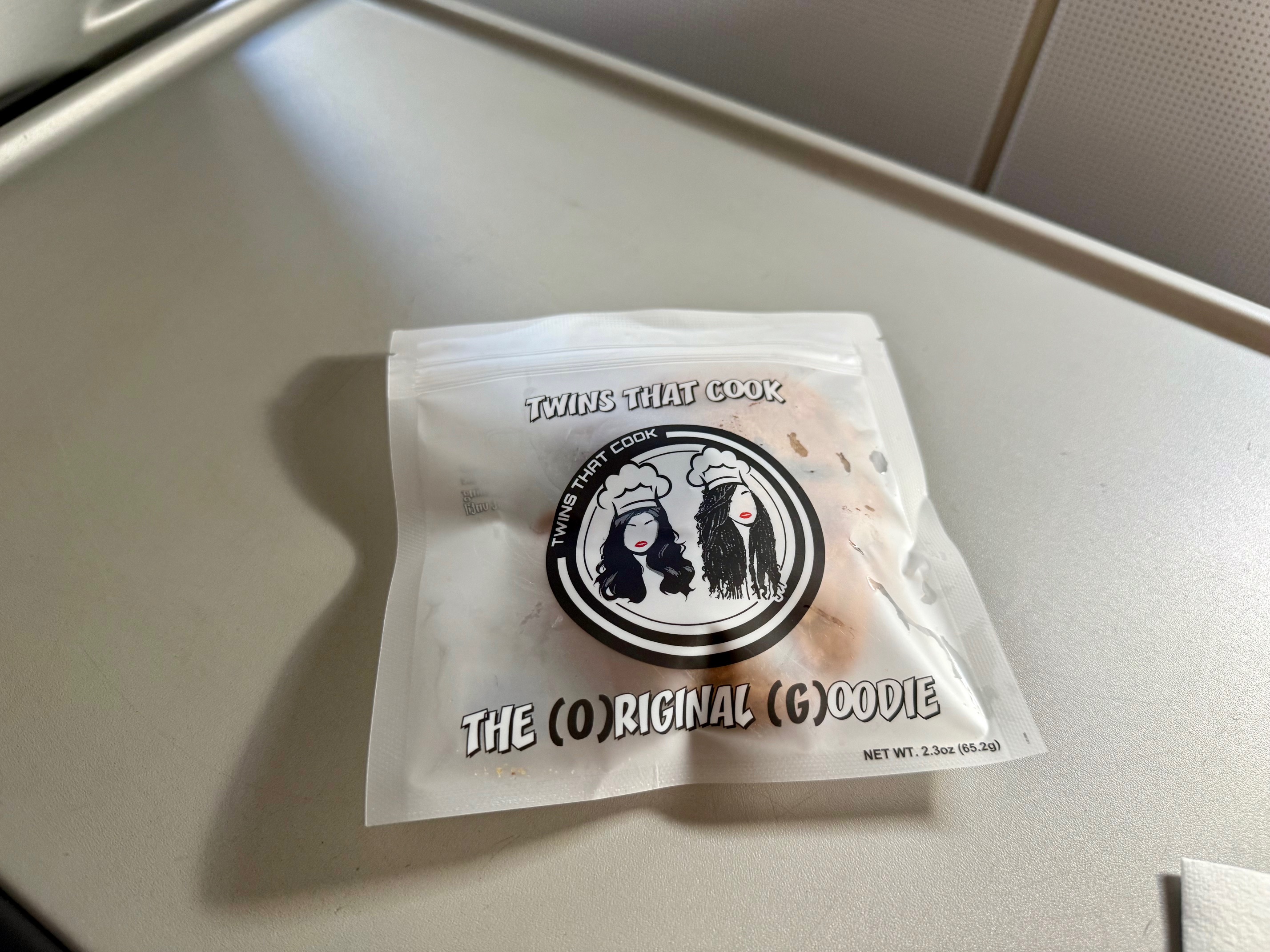 a small white package with black text on it